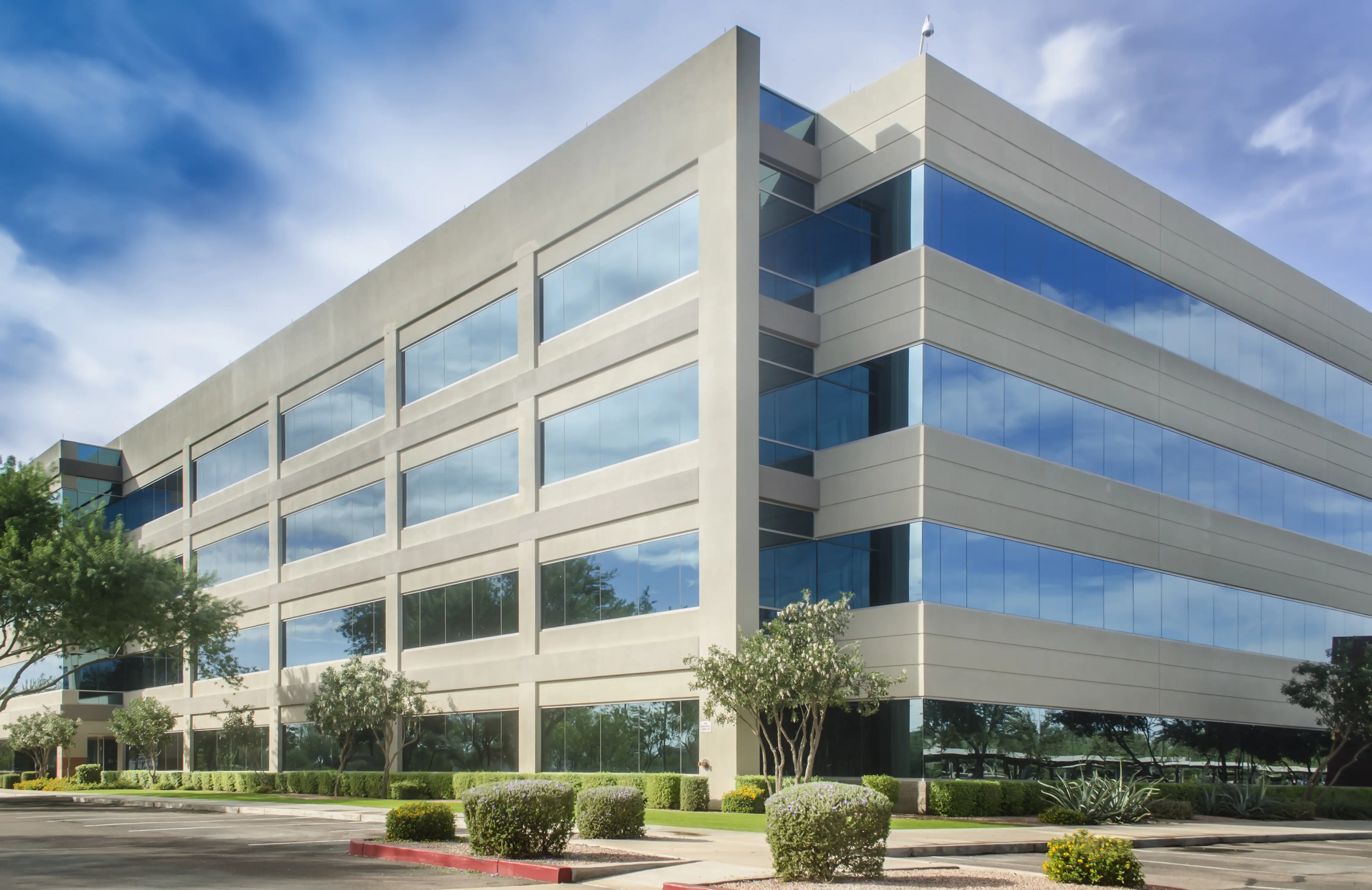 Professional pest control technician inspecting modern office building