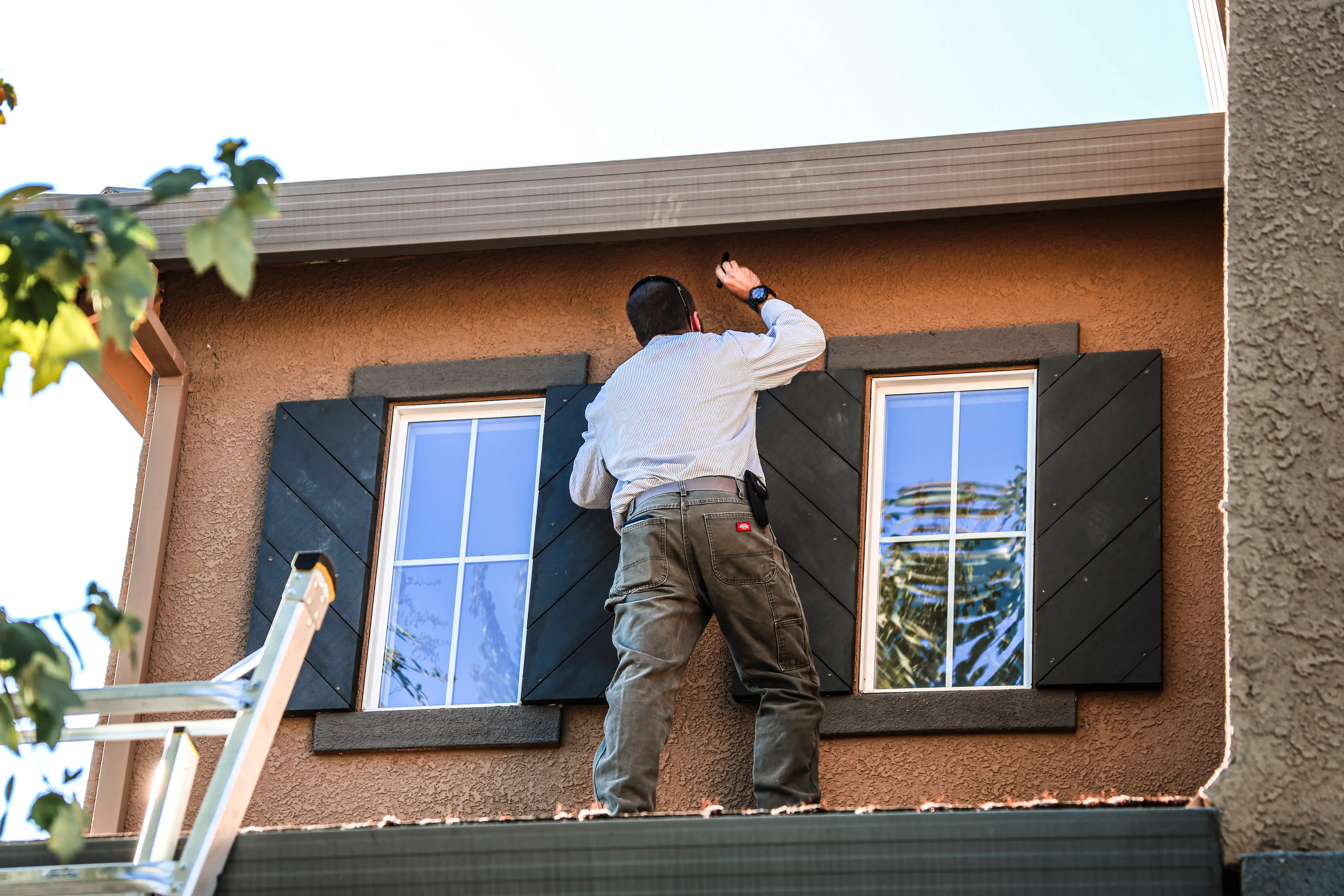 Licensed technician inspecting home for rodent activity
